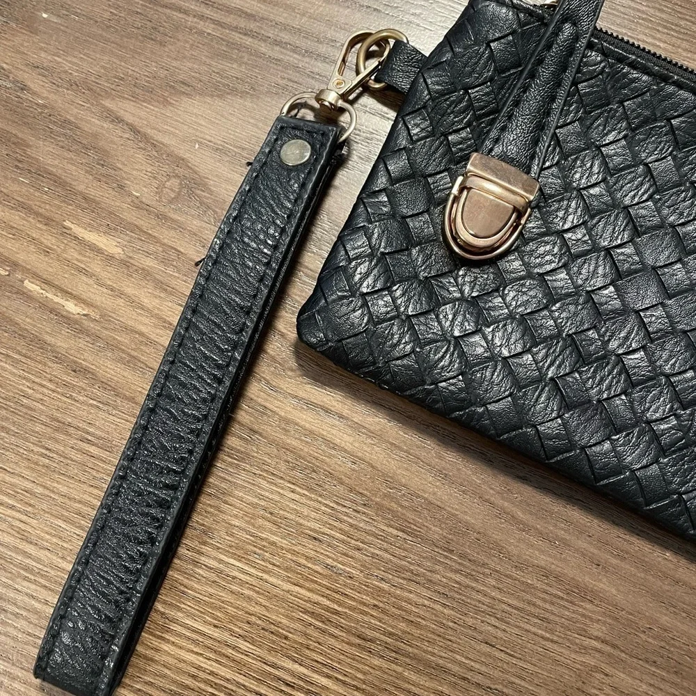 Small Black Pattern Wristlet With Zipper & Metal Clasp Closure.